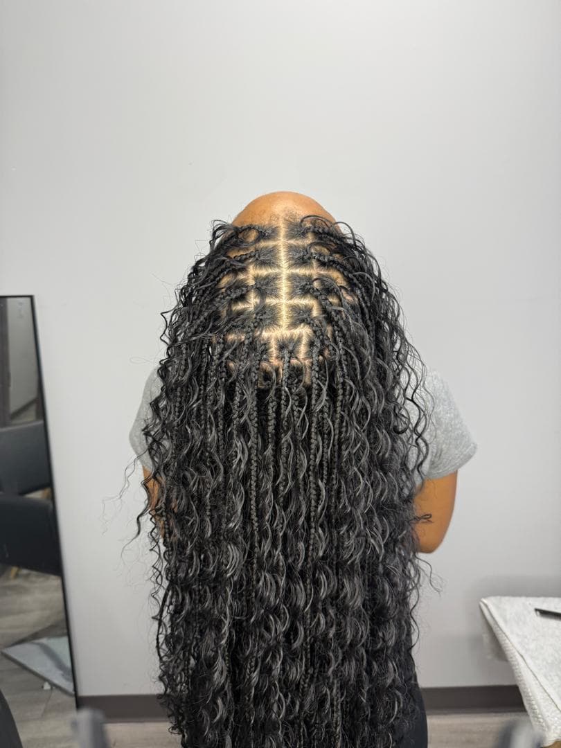 Long boho knotless braids with silver-grey curly ends, styled in Baltimore MD