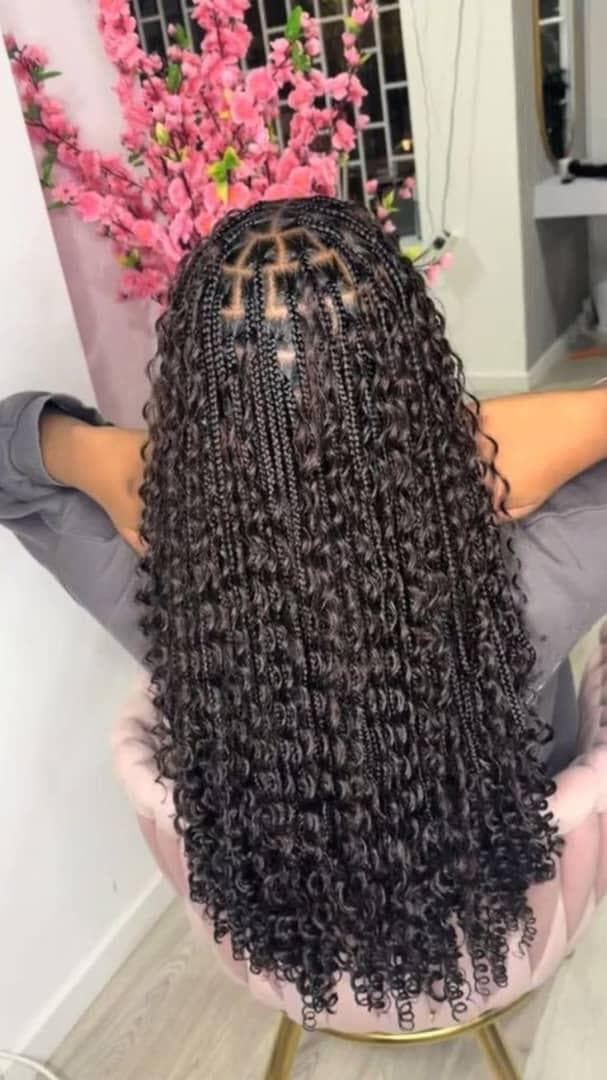 Knotless braids with curly ends, styled at Irene's Hair Beauty, Baltimore MD